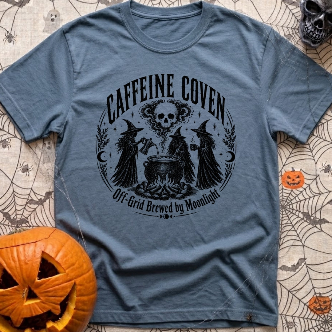 Wake The Coven - T-Shirt in Blue Jean - A black and white circular illustration of three witches standing around a...