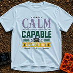 Calm Capable Camped Out - T-Shirt in Chambray - A typographic design featuring the words "CALM CAPABLE CAMPED OUT"...