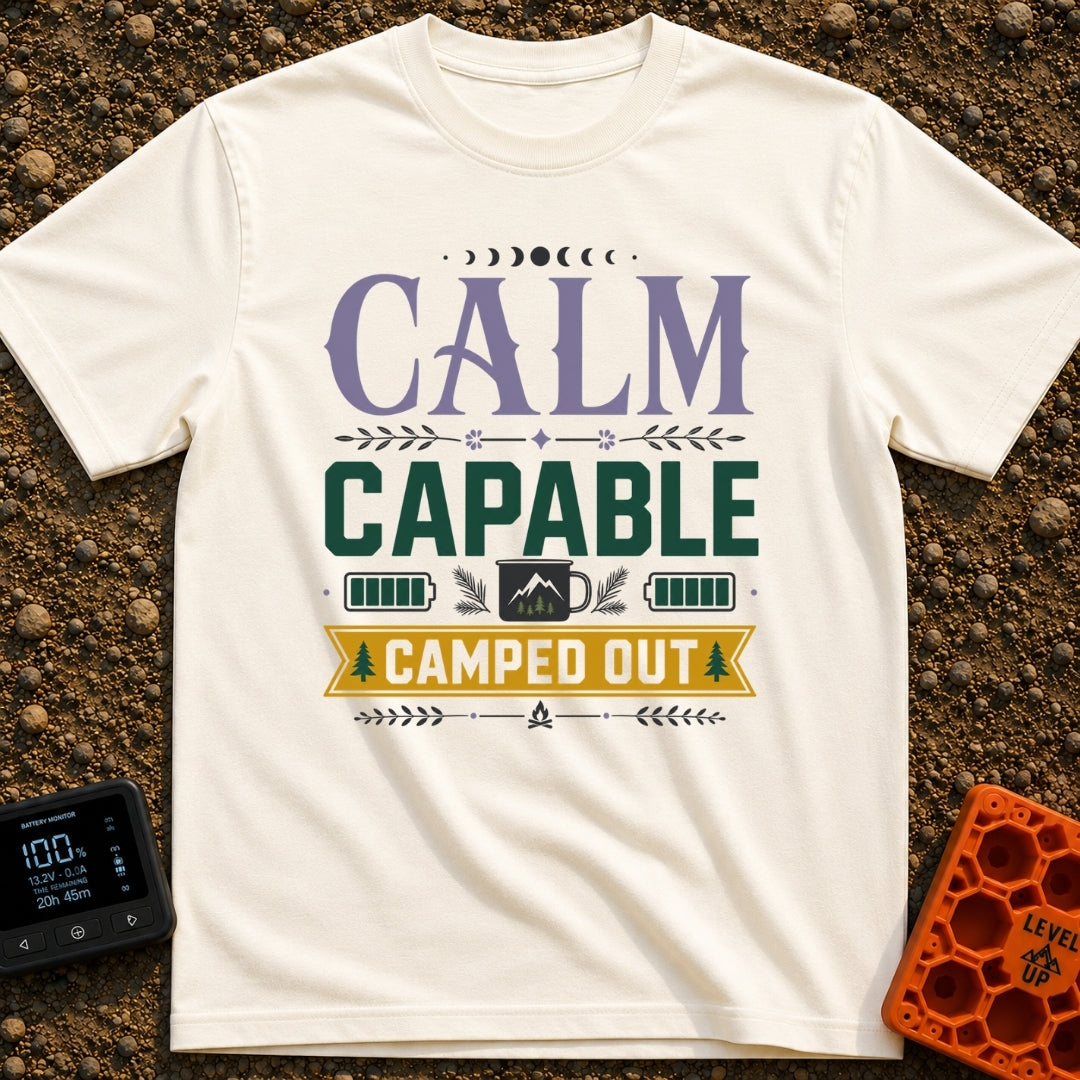 Calm Capable Camped Out - T-Shirt in Ivory - A typographic design featuring the words "CALM CAPABLE CAMPED OUT" arranged...