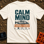 Calm And Capable - T-Shirt in Ivory - A typographic graphic reading "CALM MIND" above a camper van parked in front of...