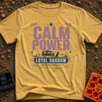 Powered By Loyal Shadows - T-Shirt in Mustard - A camper van parked next to a silhouette of a sitting dog with mountains...