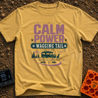 Powered By Wagging Tails - T-Shirt in Mustard - A graphic design featuring the text "CALM POWER WAGGING TAIL" and "Quiet...