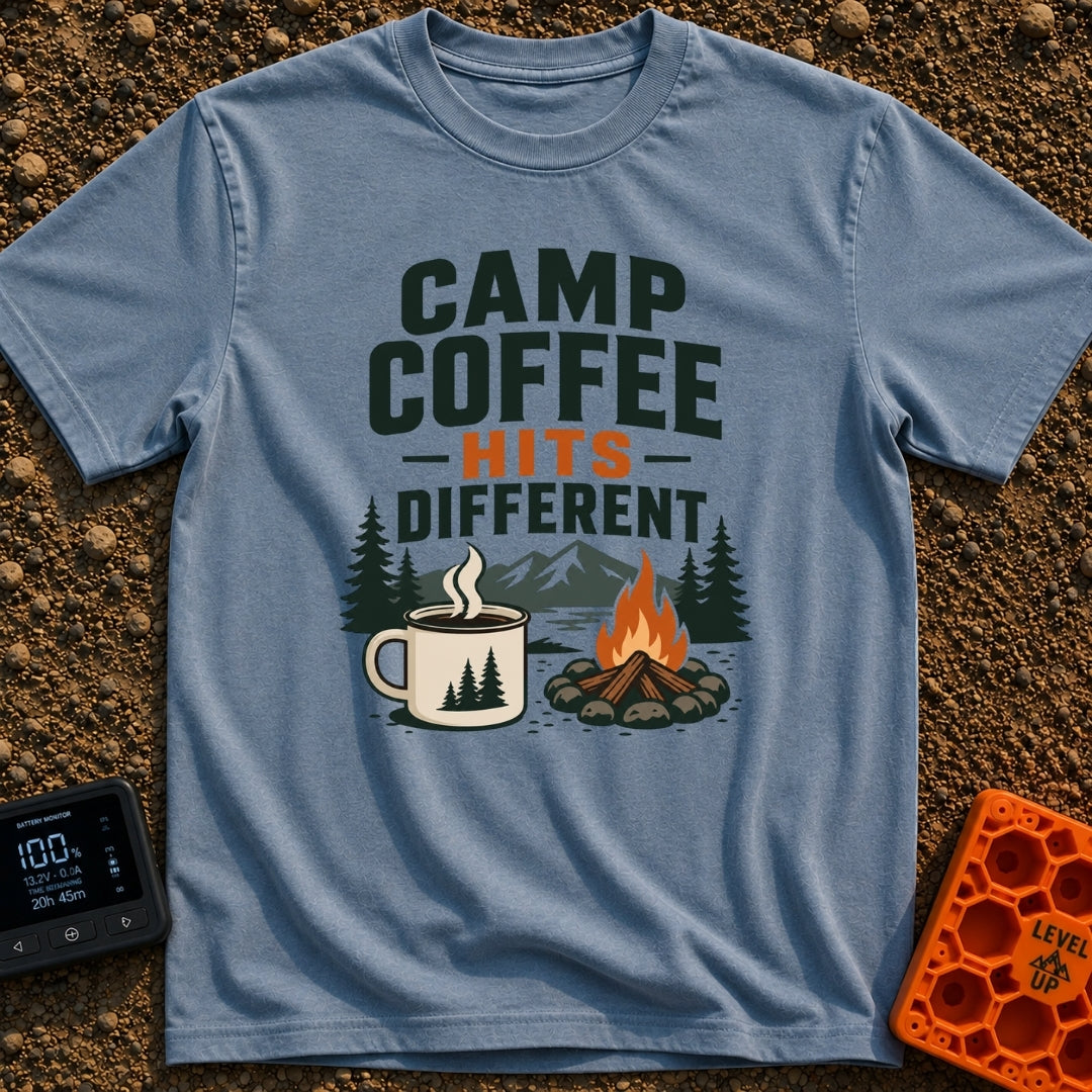 Brew Hits Different - T-Shirt in Blue Jean - A graphic showing a steaming enamel camp mug next to a stone-ringed...