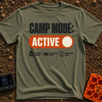 Camp Mode Active - T-Shirt in Moss - The design features the text "CAMP MODE:" above a large orange toggle switch in the...