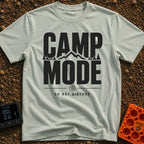 Camp Mode Activated - T-Shirt in Bay - Bold typographic design reading "CAMP MODE" with a silhouette of mountains and...
