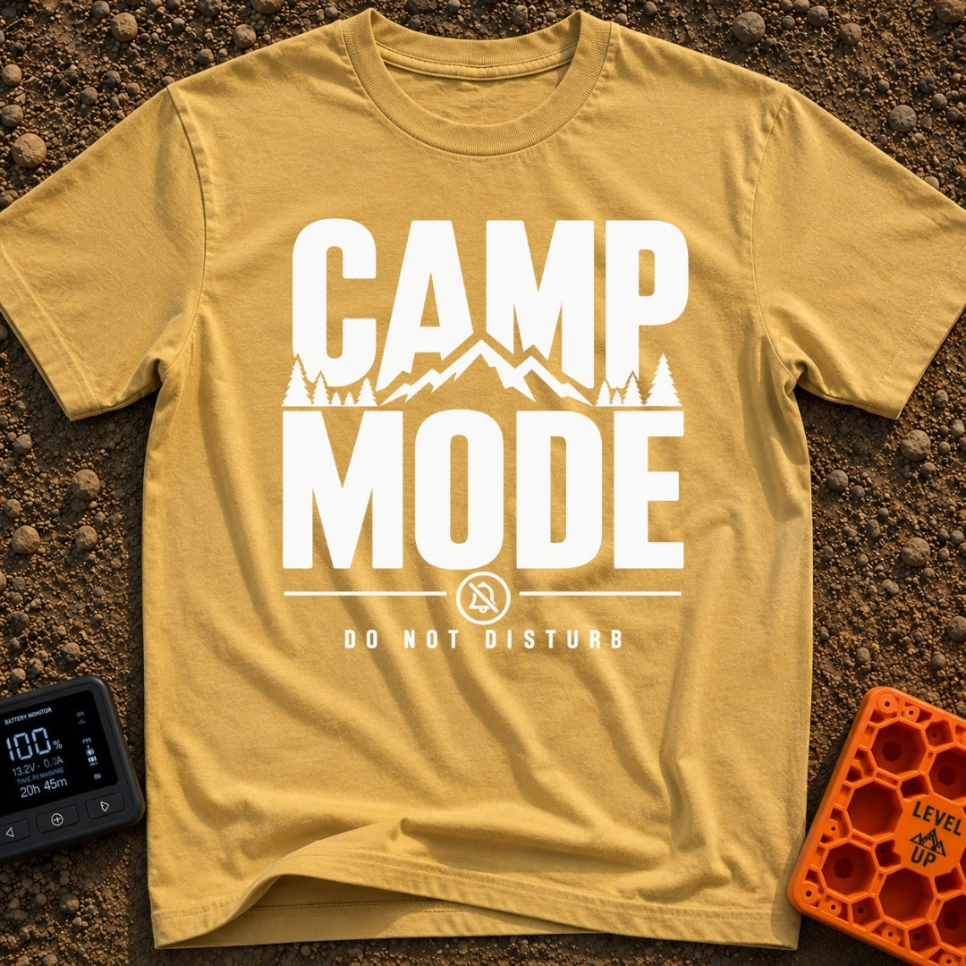 Camp Mode Activated - T-Shirt in Mustard - Bold typographic design reading "CAMP MODE" with a silhouette of mountains and...
