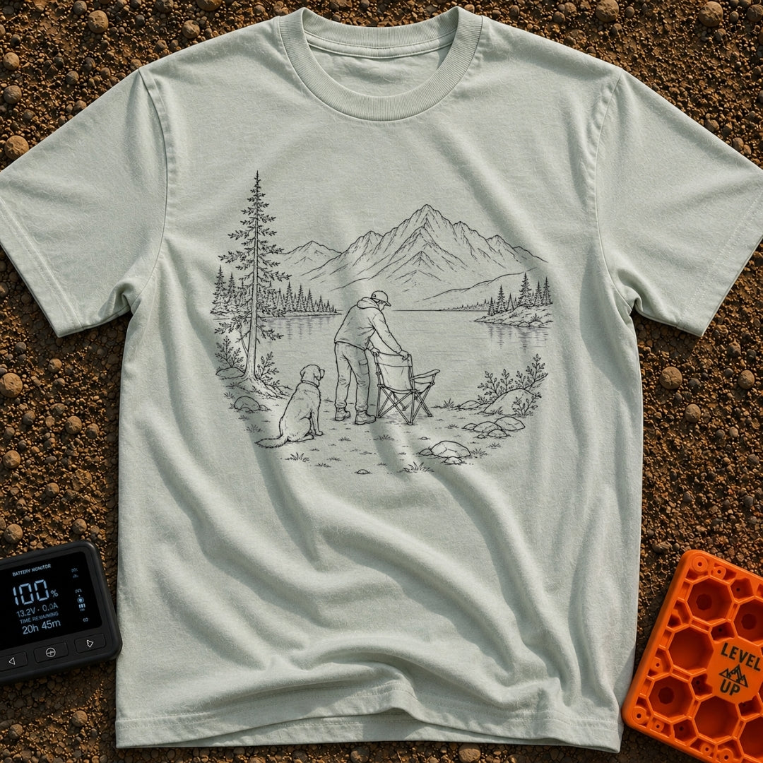 Paws-On Camp Setup - T-Shirt in Bay - A black and white line illustration of a man setting up a folding camp chair on the...