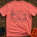 Paws-On Camp Setup - T-Shirt in Watermelon - A black and white line illustration of a man setting up a folding camp chair...