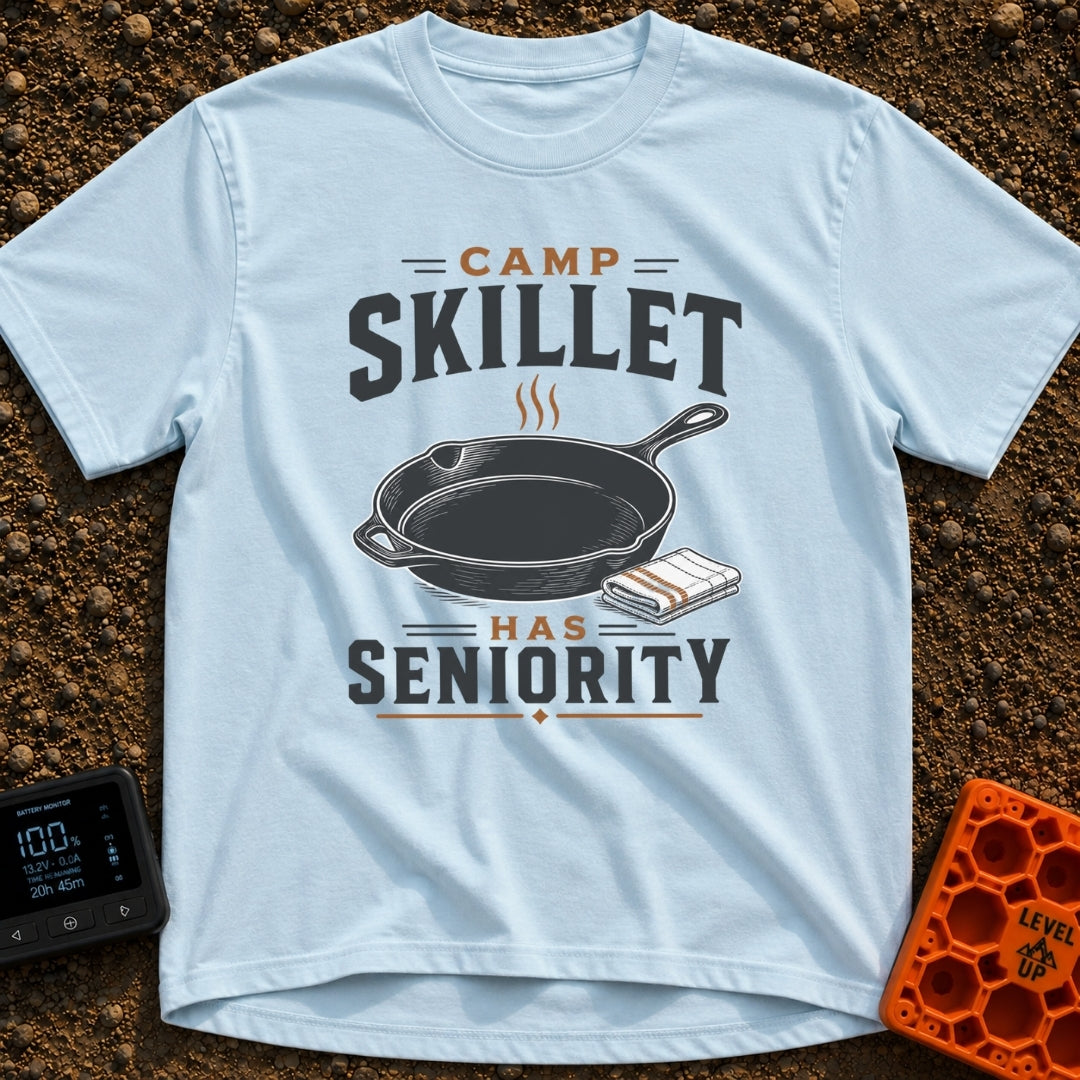 Skillet Has Seniority - T-Shirt in Chambray - A graphic illustration of a steaming cast-iron skillet next to a folded...