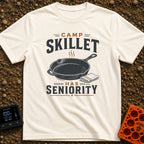 Skillet Has Seniority - T-Shirt in Ivory - A graphic illustration of a steaming cast-iron skillet next to a folded...