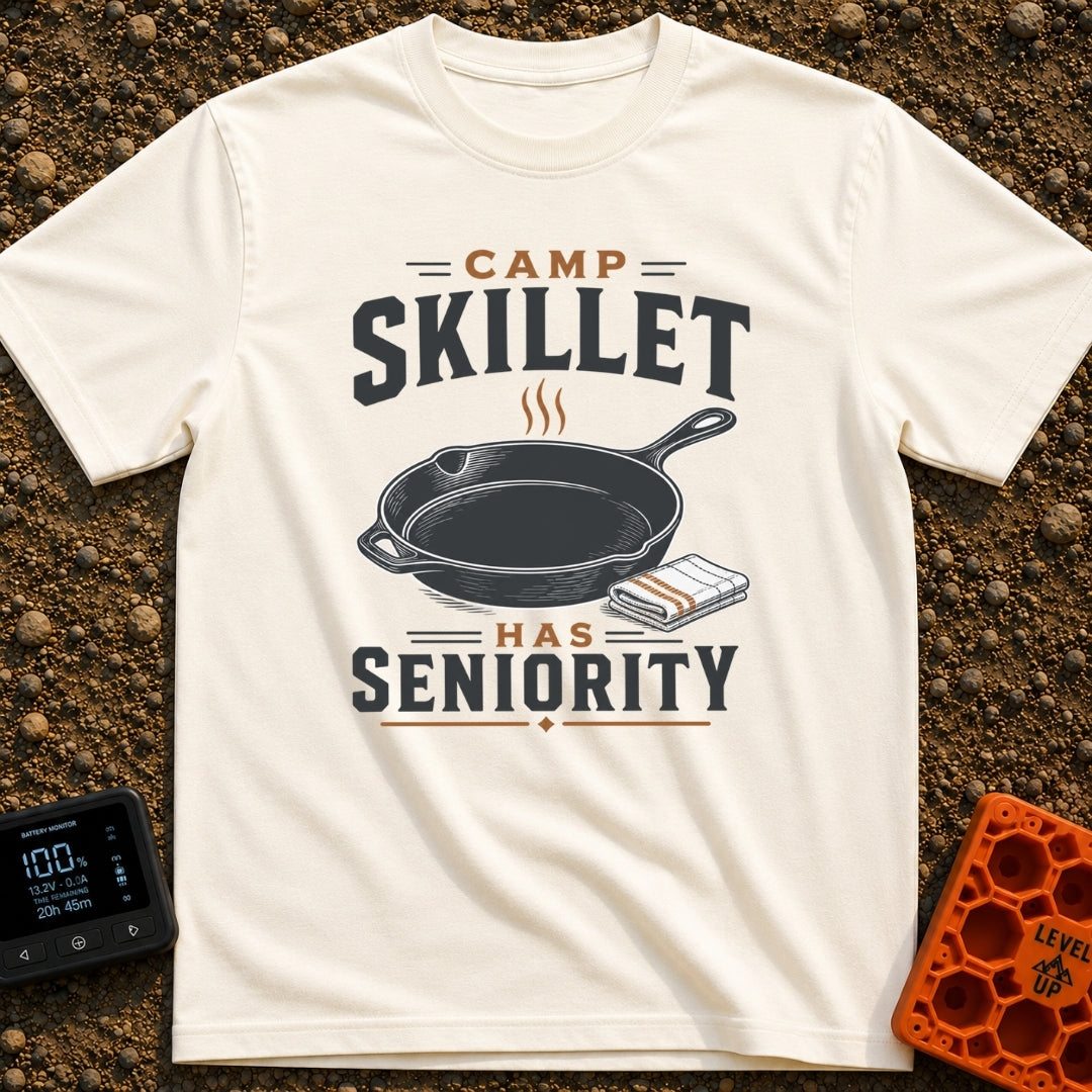 Skillet Has Seniority - T-Shirt in Ivory - A graphic illustration of a steaming cast-iron skillet next to a folded...
