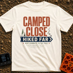 Best Commute Ever - T-Shirt in Ivory - Typographic design reading "CAMPED CLOSE" above a blue directional arrow sign...