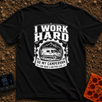 Primary Campervan Provider - T-Shirt in Black - A black and white typographic design featuring a rugged campervan parked...