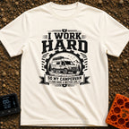 Primary Campervan Provider - T-Shirt in Ivory - A black and white typographic design featuring a rugged campervan parked...