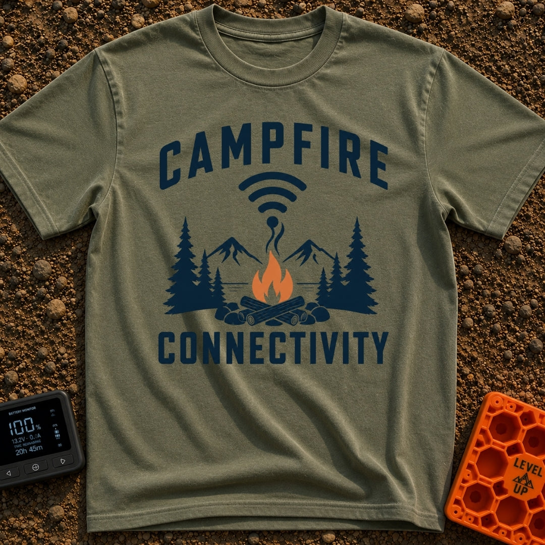 The Original Hot Spot - T-Shirt in Moss - A graphic illustration featuring a campfire in a rock ring with pine trees and...