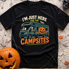 Unexplained Campfire Attendance - T-Shirt in Black - A skeleton throws a peace sign from the driver's window of a blue...