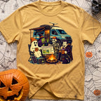 Unexplainable Campfire Attendance - T-Shirt in Mustard - A cartoon illustration of a ghost, witch, skeleton, and vampire...