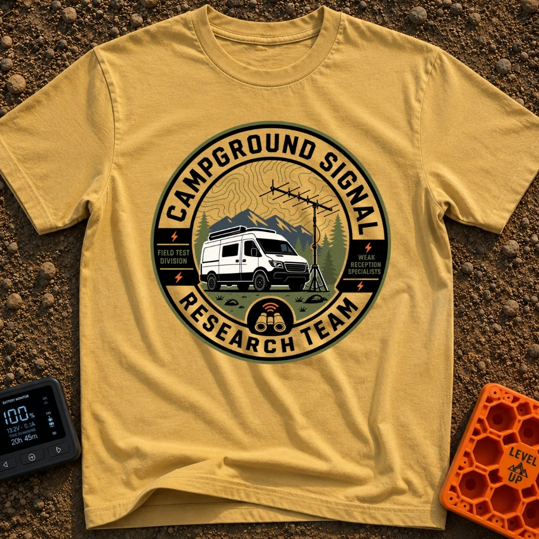 Signal Research Team - T-Shirt in Mustard - A circular badge illustration showing a white camper van parked in front of...
