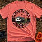 Signal Research Team - T-Shirt in Watermelon - A circular badge illustration showing a white camper van parked in front...