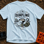 Campsite Dumpling Bureau - T-Shirt in Chambray - A badge-style illustration showing a camper van in the woods next to a...