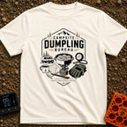 Campsite Dumpling Bureau - T-Shirt in Ivory - A badge-style illustration showing a camper van in the woods next to a camp...