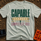 Charged To Roam Free - T-Shirt in Bay - A typographic design featuring the words "CAPABLE CHARGED COMPLETELY FREE"...