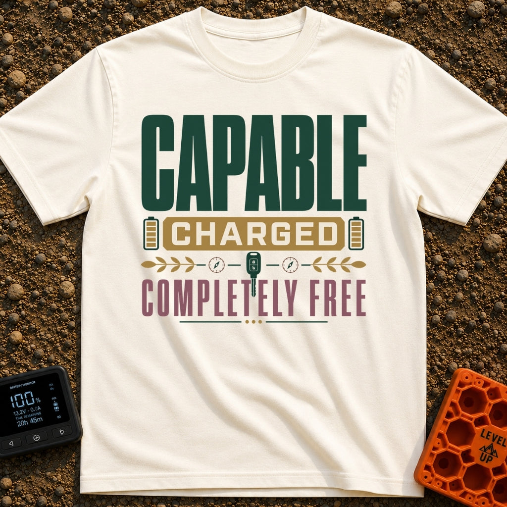 Charged To Roam Free - T-Shirt in Ivory - A typographic design featuring the words "CAPABLE CHARGED COMPLETELY FREE"...