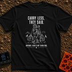 Pack Light They Said - T-Shirt in Black - A white line drawing of a tired man hiking past mountains and pine trees,...