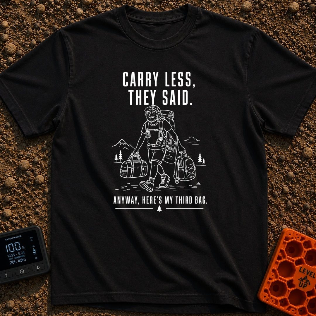 Pack Light They Said - T-Shirt in Black - A white line drawing of a tired man hiking past mountains and pine trees,...