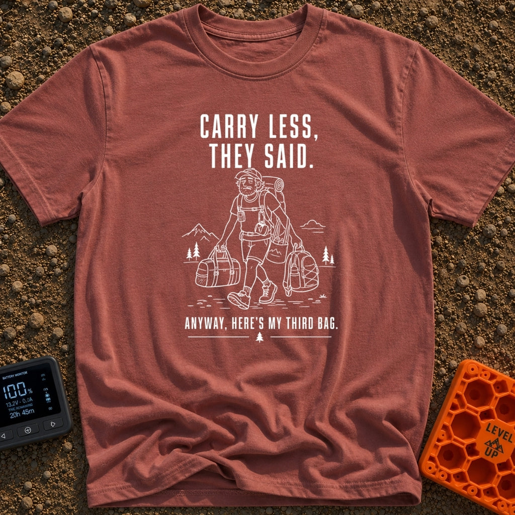 Pack Light They Said - T-Shirt in Brick - A white line drawing of a tired man hiking past mountains and pine trees,...
