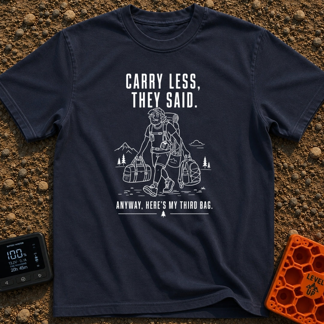 Pack Light They Said - T-Shirt in Navy - A white line drawing of a tired man hiking past mountains and pine trees,...