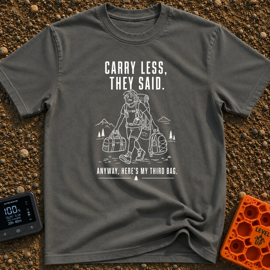 Pack Light They Said - T-Shirt in Pepper - A white line drawing of a tired man hiking past mountains and pine trees,...