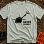 Cast Iron Compass - T-Shirt in Bay - A graphic featuring a black cast iron skillet superimposed over a multi-pointed...