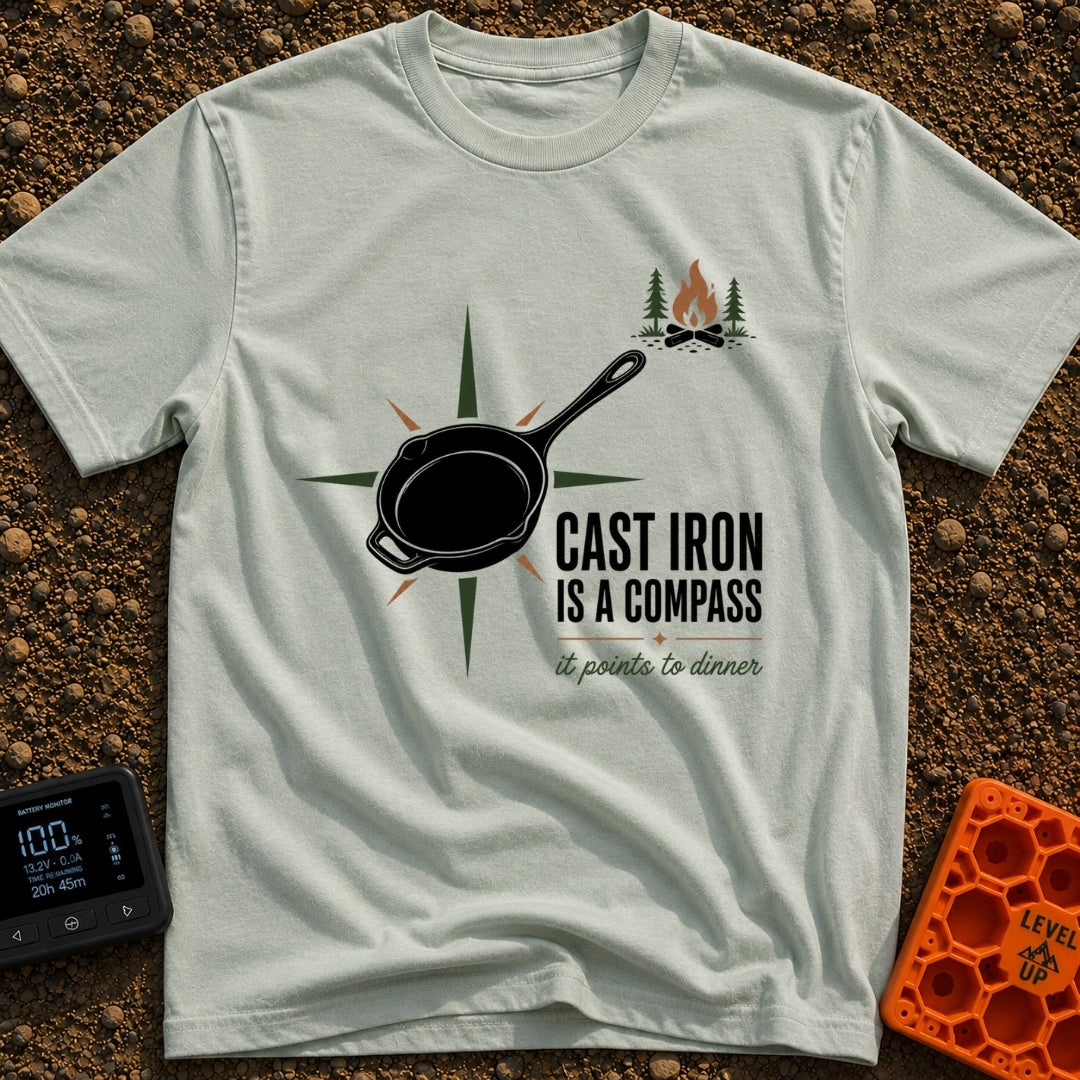 Cast Iron Compass - T-Shirt in Bay - A graphic featuring a black cast iron skillet superimposed over a multi-pointed...