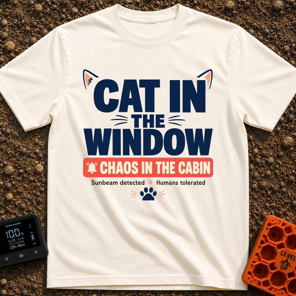 Chaos In The Cabin - T-Shirt in Ivory - A typographic design featuring the text "CAT IN THE WINDOW" with stylized cat...