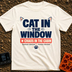 Chaos In The Cabin - T-Shirt in Ivory - A typographic design featuring the text "CAT IN THE WINDOW" with stylized cat...