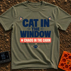 Chaos In The Cabin - T-Shirt in Moss - A typographic design featuring the text "CAT IN THE WINDOW" with stylized cat ears...