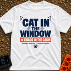 Chaos In The Cabin - T-Shirt in White - A typographic design featuring the text "CAT IN THE WINDOW" with stylized cat...