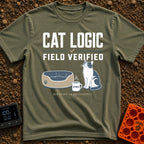 Cat Logic Certified - T-Shirt in Moss - A black and white cat sitting upright next to an empty round pet bed, with a...