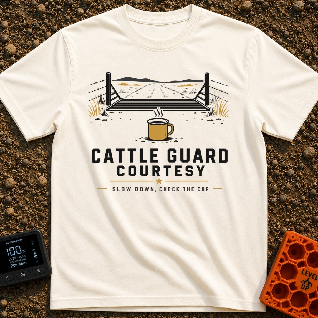 Cattle Guard Java - T-Shirt in Ivory - A graphic showing a dirt road passing over a metal cattle guard between barbed...