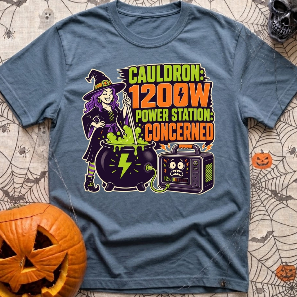 Watts In The Cauldron - T-Shirt in Blue Jean - A cartoon witch with purple hair stirs a bubbling green cauldron that is...