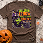 Watts In The Cauldron - T-Shirt in Espresso - A cartoon witch with purple hair stirs a bubbling green cauldron that is...