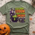 Watts In The Cauldron - T-Shirt in Moss - A cartoon witch with purple hair stirs a bubbling green cauldron that is...