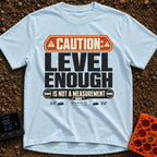 That Looks Level Enough - T-Shirt in Chambray - A text-based design featuring an orange warning banner reading...