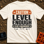 That Looks Level Enough - T-Shirt in Ivory - A text-based design featuring an orange warning banner reading "CAUTION:",...