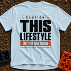 May Void Your Routine - T-Shirt in Chambray - A typographic design styled like an industrial warning label featuring the...