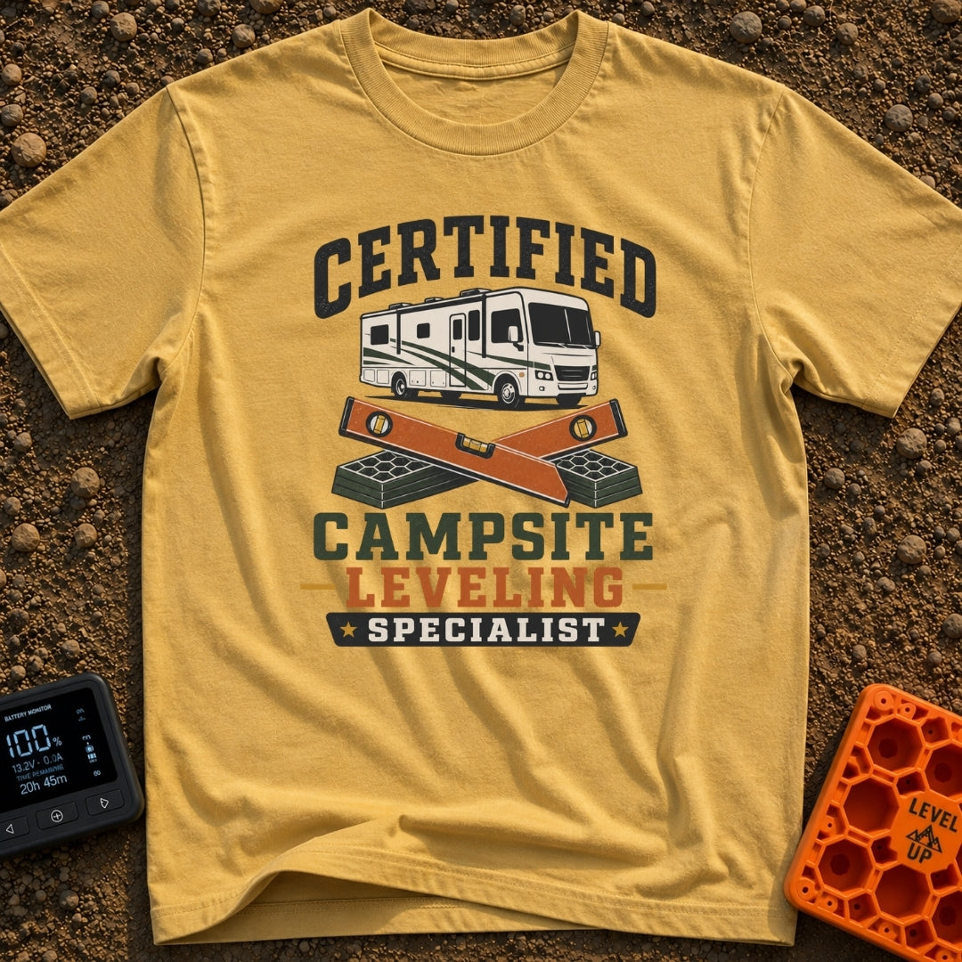 Certified Leveling Specialist - T-Shirt in Mustard - A graphic featuring a white and green motorhome parked above two...