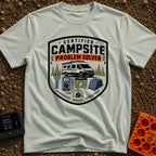 Campsite Crisis Wrangler - T-Shirt in Bay - A badge-style illustration of a white camper van parked among pine trees,...