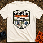 Campsite Crisis Wrangler - T-Shirt in Ivory - A badge-style illustration of a white camper van parked among pine trees,...