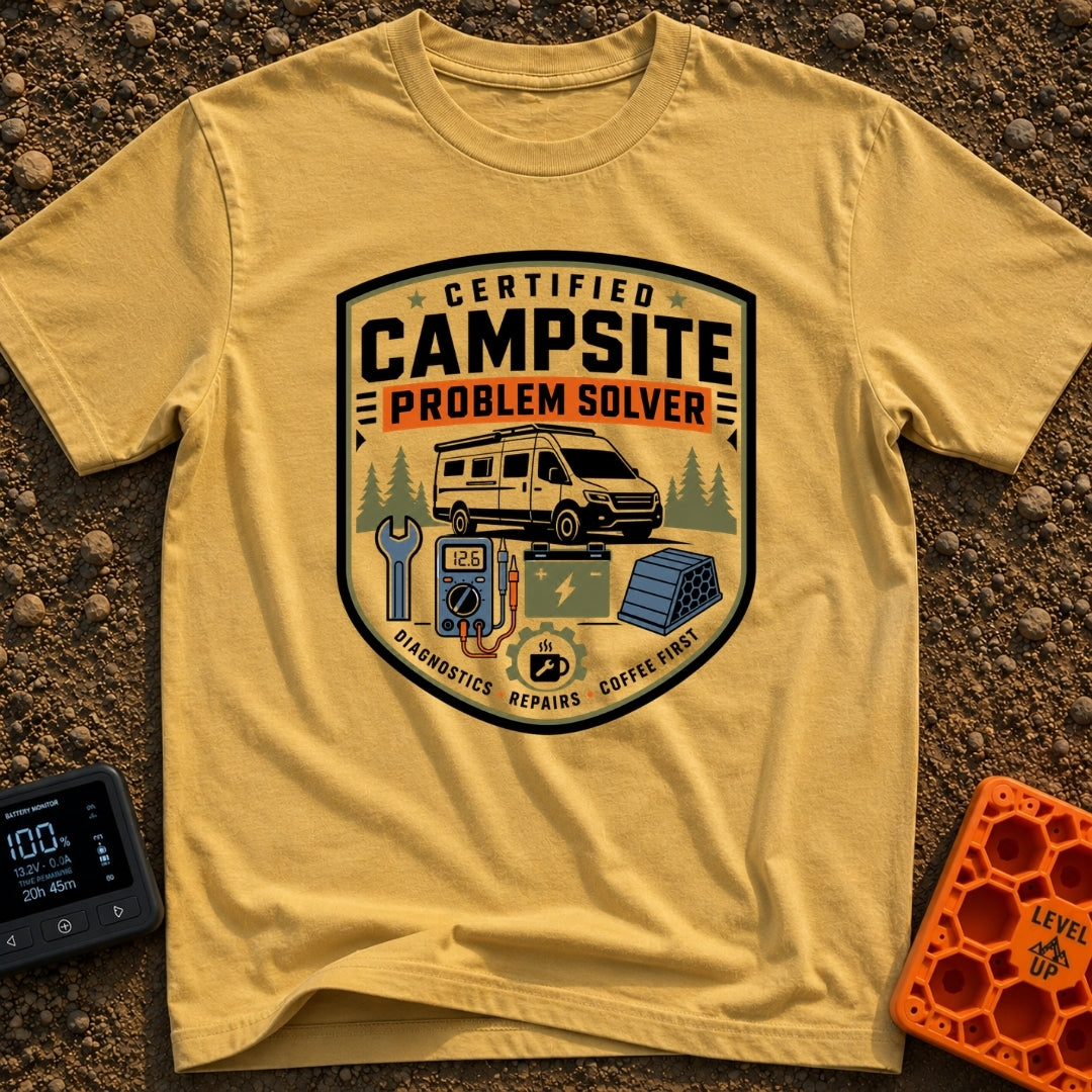 Campsite Crisis Wrangler - T-Shirt in Mustard - A badge-style illustration of a white camper van parked among pine trees,...